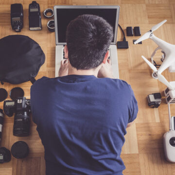 high-angle-view-mid-adult-man-using-laptop-by-drone (2)