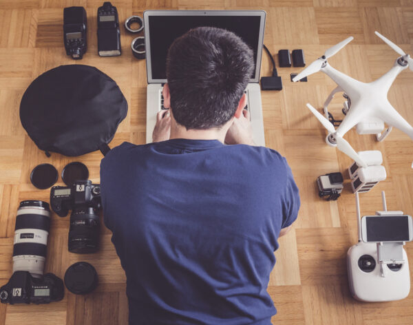high-angle-view-mid-adult-man-using-laptop-by-drone (2)