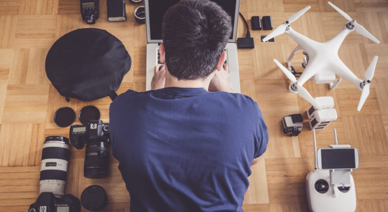 high-angle-view-mid-adult-man-using-laptop-by-drone (2)