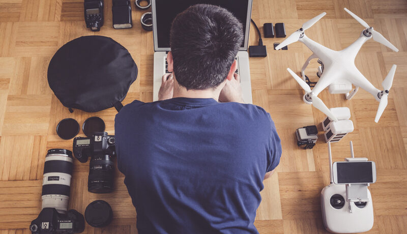 high-angle-view-mid-adult-man-using-laptop-by-drone (2) high-angle-view-mid-adult-man-using-laptop-by-drone (2)